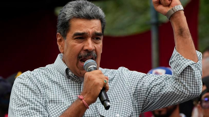 FILE - Venezuela's President Nicolas Maduro addresses government loyalists gathered at the presidential palace in support of his reelection one month after the presidential vote, in Caracas, Venezuela, Aug. 28, 2024. (AP Photo/Ariana Cubillos, File)