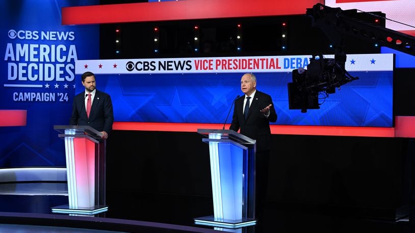  Gov. Tim Walz of Minnesota speaks as Sen. JD Vance (R-Ohio) listens during the vice-presidential debate at the CBS Broadcast Center in New York on Tuesday, Oct. 1, 2024. (Kenny Holston/The New York Times) 