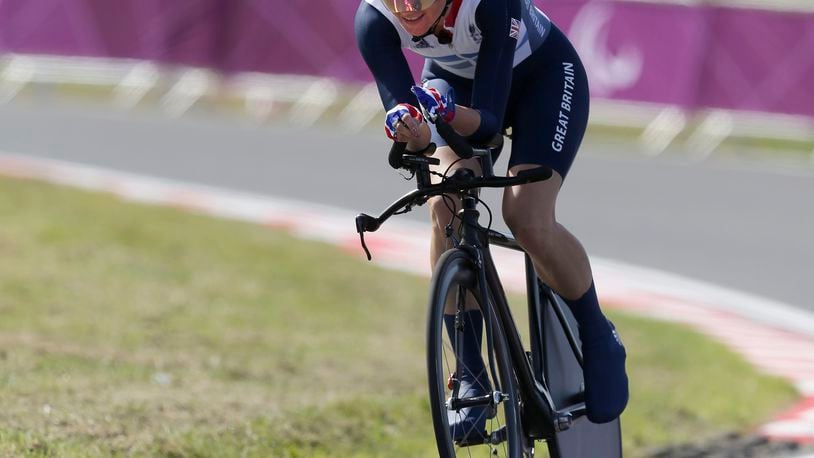 FILE - Sarah Story of Britain competes in her women's road cycling C5 category time trial at the 2012 Paralympics games, Wednesday, Sept. 5, 2012, at Brands Hatch motor racing circuit near London. (AP Photo/Alastair Grant, File)