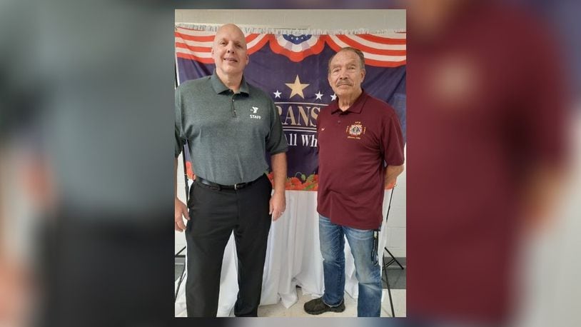 Vietnam War Veteran Fred Williams stands next to Champaign Family YMCA CEO Paul Waldsmith. From 1967 to 1971, Williams served in the USMC as a Sergeant UH-34 Helicopter Crew Chief & Gunner. Currently, Williams is the VFW Quartermaster and DAV adjutant for the Urbana Veterans of Foreign Wars/Spriggs-Wing Post 5451/DAV Chapter 31. Contributed