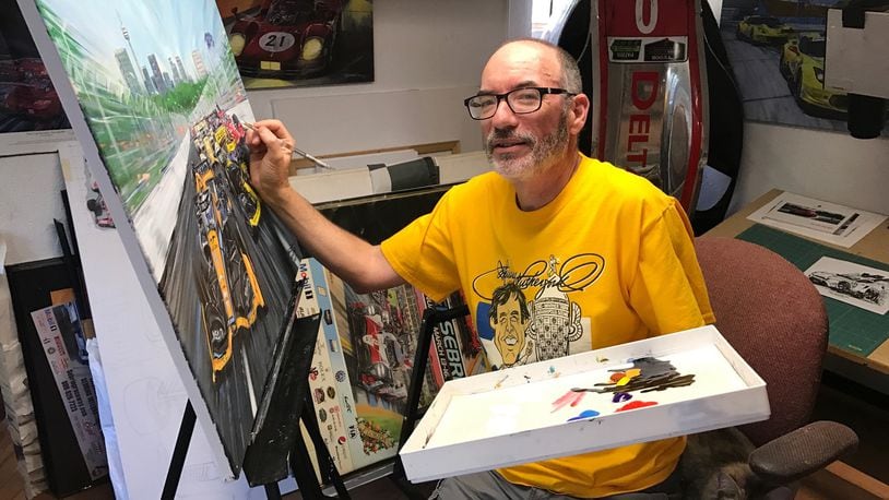 In the studio of his home in Hamilton, artist Roger Warrick works on a scene he painted from the Toronto Indy race. Tom Archdeacon/CONTRIBUTED