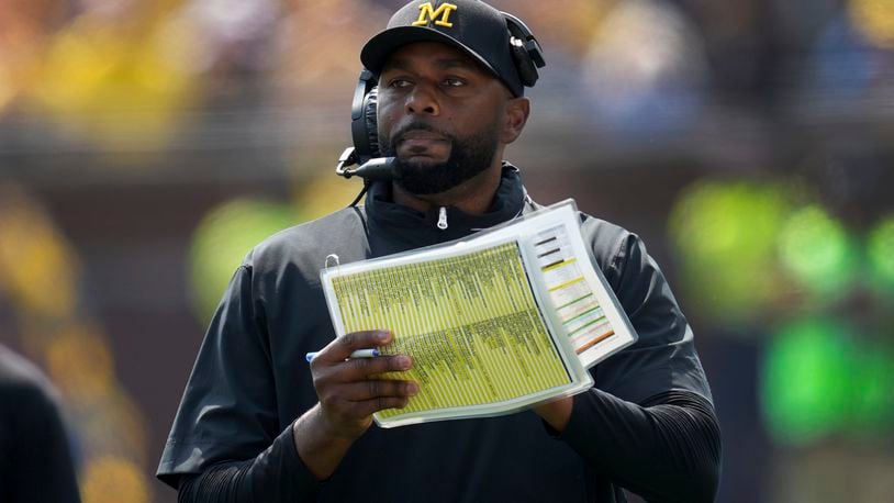 Michigan head coach Sherrone Moore watches against Arkansas State in the first half of an NCAA college football game in Ann Arbor, Mich., Saturday, Sept. 14, 2024. (AP Photo/Paul Sancya)