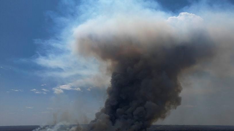 Smoke rises from a fire in the environmentally protected area of Brasilia National Park during the dry season in Brasilia, Brazil, Monday, Sept. 16, 2024. The head of the agency that manages protected areas, Mauro Pires, told the local press that the fire is man-made and appears to have started near the edge of a farm. (AP Photo/Eraldo Peres)