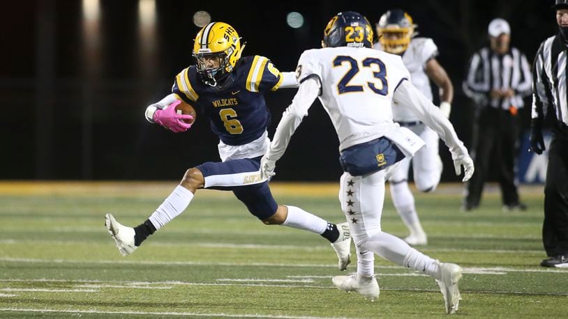 Springfield's Shawn Thigpen runs after a catch against Moeller in the Division I state semifinals at Sidney High School on Friday, Nov. 26, 2021. Michael Cooper/CONTRIBUTED