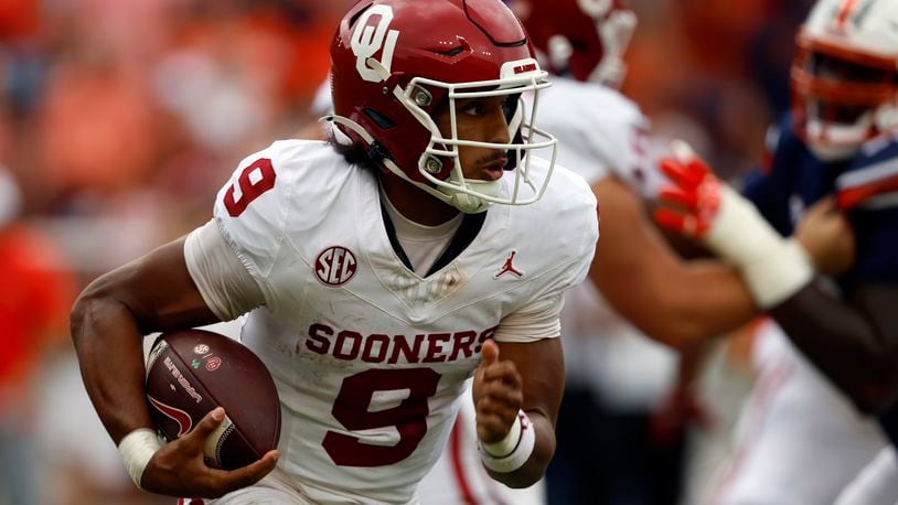 Oklahoma quarterback Michael Hawkins Jr. (9) carries the ball against Auburn during the first half of an NCAA college football game, Saturday, Sept. 28, 2024, in Auburn, Ala. (AP Photo/Butch Dill)