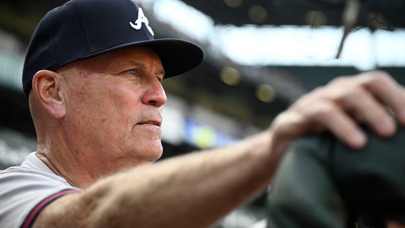 Atlanta Braves manager Brian Snitker watches from the dugout before the team's baseball game against the Baltimore Orioles, Wednesday, June 12, 2024, in Baltimore. (AP Photo/Nick Wass)