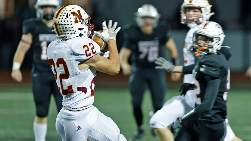 Northeastern's Garrett Chadwell catches a pass for a Jets first down against Waynesville. BILL LACKEY/STAFF