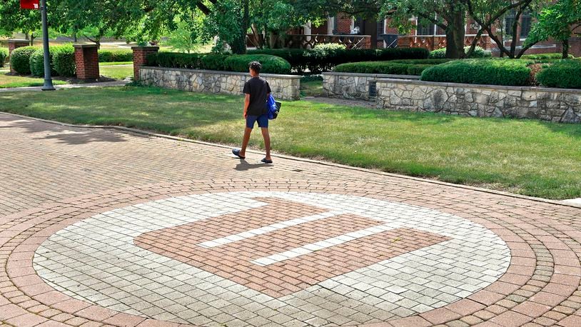 A man walks across the campus of Wittenberg University Thursday, August 1, 2024. BILL LACKEY/STAFF