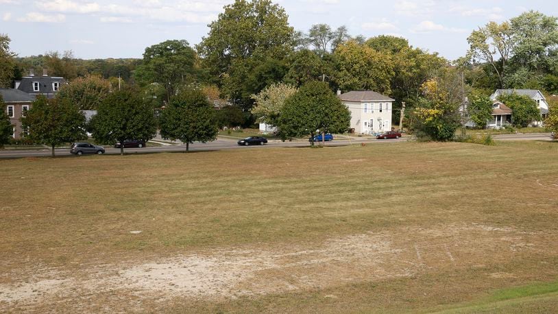 The vacant field at 1315 W. High St. is the site of a proposed apartment complex. BILL LACKEY/STAFF