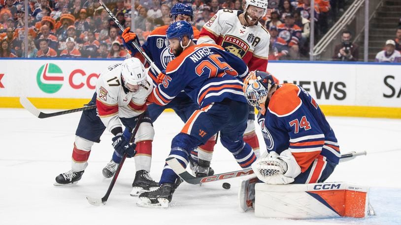 Florida Panthers' Evan Rodrigues (17) is stopped by Edmonton Oilers goalie Stuart Skinner (74) during the third period of Game 6 of the NHL hockey Stanley Cup Final, Friday, June 21, 2024, in Edmonton, Alberta. The Oilers won 5-1 to tie the series. (Jason Franson/The Canadian Press via AP)