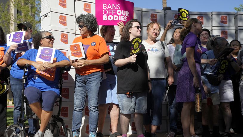 FILE - Arizona abortion-rights supporters gather for a news conference prior to delivering over 800,000 petition signatures to the capitol to get abortion rights on the November general election ballot Wednesday, July 3, 2024, in Phoenix. (AP Photo/Ross D. Franklin, File)