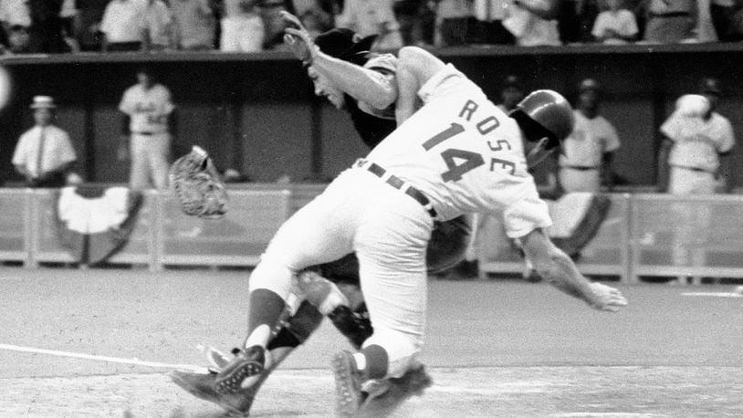 FILE - In this July 14, 1970, file photo, National League's Pete Rose collides with American League catcher Ray Fosse as he scores the winning run during the 12th inning of the baseball All-Star Game in Cincinnati. Fosse, the strong-armed catcher whose career was upended when he was bowled over by Rose, has died. He was 74. Carol Fosse, his wife of 51 years, said in a statement Fosse died Wednesday, Oct. 13, 2021, after a 16-year bout with cancer. (AP Photo/File)