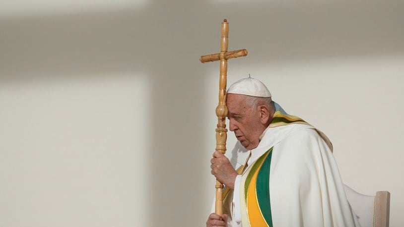 Pope Francis holds the pastoral staff as he presides over the Sunday mass at King Baudouin Stadium, in Brussels Sunday, Sept. 29, 2024. (AP Photo/Andrew Medichini)