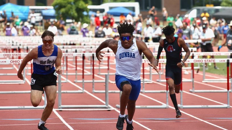 Dunbar's Dai'Vontay Young races to victory in the 110-meter hurdles at the Division II state track meet on Saturday, June 3, 2023, at Jesse Owens Memorial Stadium in Columbus, Ohio. David Jablonski/Staff