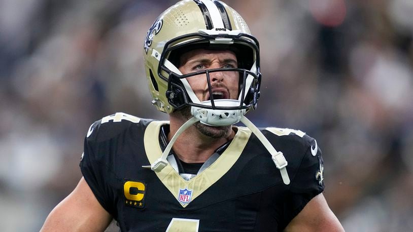 New Orleans Saints quarterback Derek Carr reacts after throwing a touchdown pass to wide receiver Rashid Shaheed during the first half of an NFL football game against the Dallas Cowboys, Sunday, Sept. 15, 2024, in Arlington, Texas. (AP Photo/Tony Gutierrez)