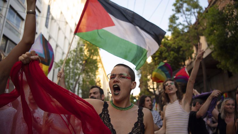 FILE — Protesters shout slogans against Israel's military operation in Gaza Strip during the annual Pride parade, in Athens, Greece, June 15, 2024. At Pride events across the U.S, internal tensions over the ongoing war between Israel and Hamas in Gaza have seeped into the festivities, spurring boycotts and demonstrations at marches and exposing divisions within a movement firmly rooted in protest. (AP Photo/Michael Varaklas, File)