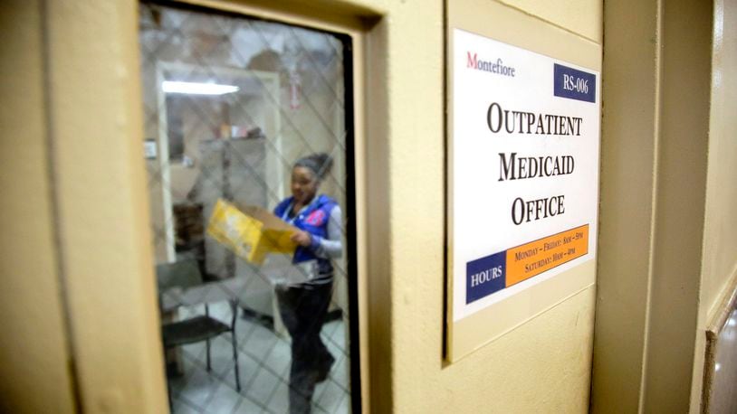 FILE - A Medicaid office employee works on reports at Montefiore Medical Center, Nov. 21, 2014, in New York. (AP Photo/Julie Jacobson, File)