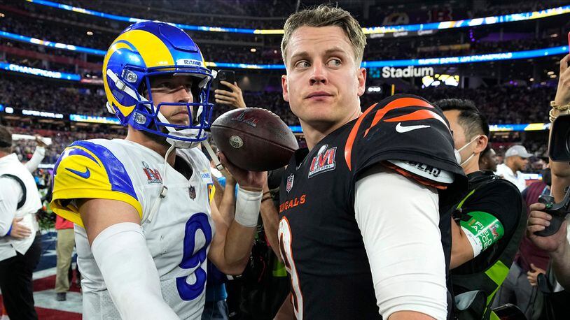 Los Angeles Rams quarterback Matthew Stafford, left, talks with Cincinnati Bengals quarterback Joe Burrow after the NFL Super Bowl 56 football game Sunday, Feb. 13, 2022, in Inglewood, Calif. (AP Photo/Chris O'Meara)