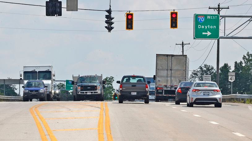 Clark County wants to widen the Ohio Route 41 overpass over Interstate 70 from four lanes to six to accommodate all the traffic from the new business at the interchange. BILL LACKEY/STAFF