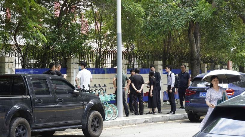 Chinese authorities inspect the scene of a stabbing at the Shenzhen Japanese School in Shenzhen, China Wednesday, Sept. 18, 2024, after a 10-year-old Japanese student was attacked by a man. (Kyodo News via AP)