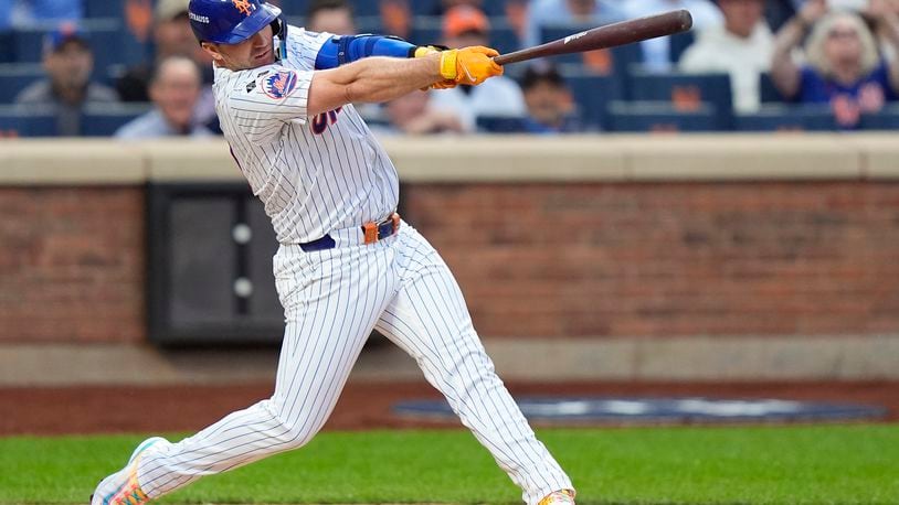 New York Mets Pete Alonso (20) connects for a solo home run against the Philadelphia Phillies during the second inning of Game 3 of the National League baseball playoff series, Tuesday, Oct. 8, 2024, in New York. (AP Photo/Frank Franklin II)