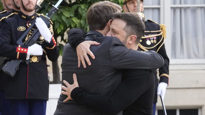 French President Emmanuel Macron, left, greets his Ukrainian counterpart Volodymyr Zelenskyy before a meeting at the Elysee Palace, in Paris, Thursday, Oct. 10, 2024. (AP Photo/Michel Euler)