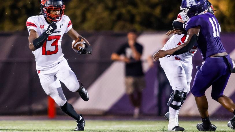 Lakota West's Kenyon Norman carries the ball during their game against Middletown. Lakota West defeated Middletown 51-7 in their football game Friday, Sept. 20, 2024 at Barnitz Stadium in Middletown. NICK GRAHAM/STAFF