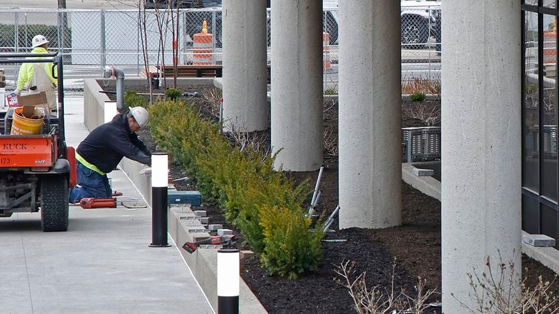 Work continues outside the Springfield City Hall on the plaza renovations Tuesday, March 26, 2024. BILL LACKEY/STAFF