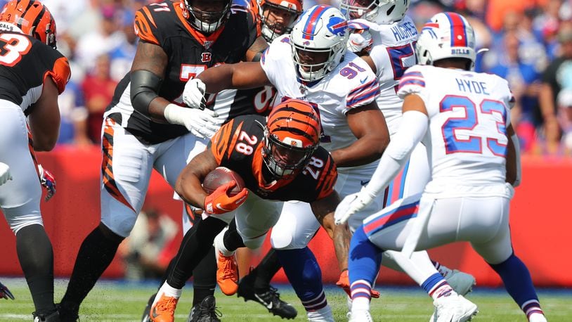 ORCHARD PARK, NY - SEPTEMBER 22: Ed Oliver #91 of the Buffalo Bills makes a tackle on Joe Mixon #28 of the Cincinnati Bengals as he runs the ball during the first quarter at New Era Field on September 22, 2019 in Orchard Park, New York. (Photo by Timothy Ludwig/Getty Images)