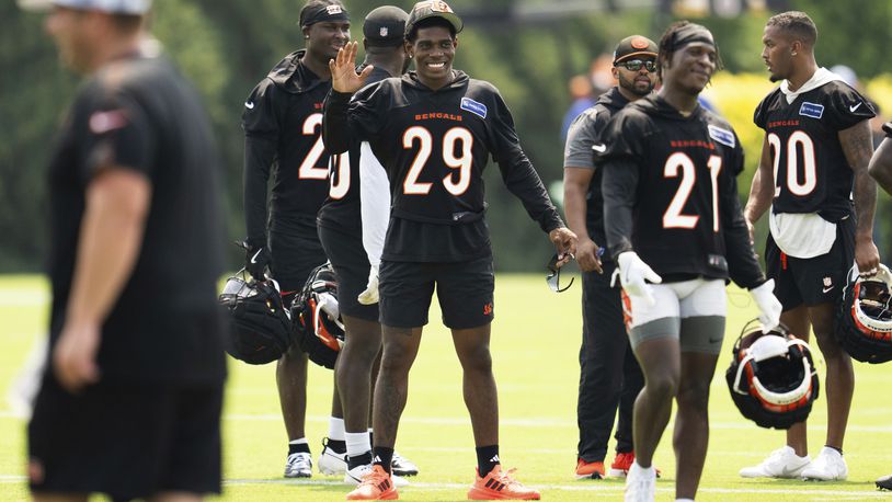 Cincinnati Bengals cornerback Cam Taylor-Britt (29) waves to a teammate during the NFL football team's training camp on Wednesday, July 24, 2024, in Cincinnati. (AP Photo/Emilee Chinn)