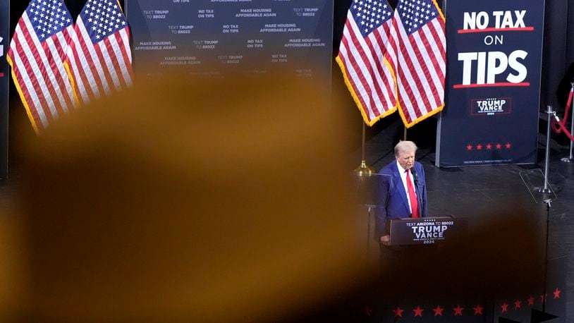 FILE - A supporter listens as Republican presidential nominee former President Donald Trump speaks during a campaign event, Sept.12, 2024, in Tucson, Ariz. (AP Photo/Alex Brandon, File)