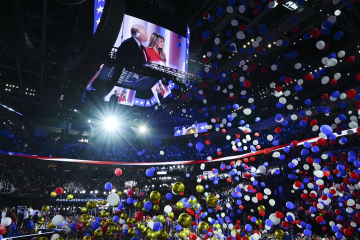 
                        A screen displays former President Donald Trump, the Republican presidential nominee, and Melania Trump as balloons fall after Trump spoke on the fourth and final night of the Republican National Convention at the Fiserv Forum in Milwaukee, on Thursday, July 18, 2024. (Jamie Kelter Davis/The New York Times)
                      