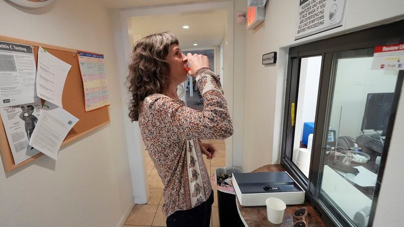 Methadone patient Irene Garnett, 44, of Phoenix, takes her treatment at a clinic in Scottsdale, Ariz., on Monday, Aug. 26, 2024. (AP Photo/Ross D. Franklin)