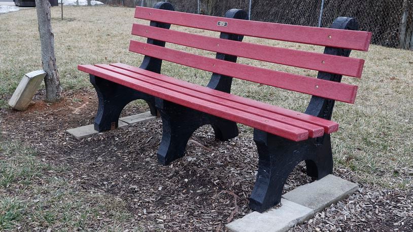 A plastic memorial bench remembering Justin White at St. Teresa Catholic Church Feb. 10, 2023. BILL LACKEY/STAFF
