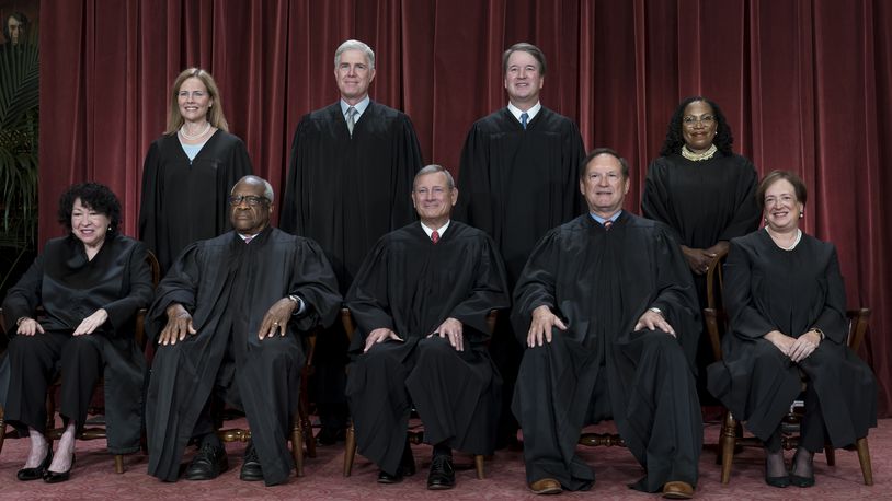 FILE - Members of the Supreme Court sit for a group portrait at the Supreme Court building in Washington, Oct. 7, 2022. Bottom row, from left, Justice Sonia Sotomayor, Justice Clarence Thomas, Chief Justice of the United States John Roberts, Justice Samuel Alito, and Justice Elena Kagan. Top row, from left, Justice Amy Coney Barrett, Justice Neil Gorsuch, Justice Brett Kavanaugh, and Justice Ketanji Brown Jackson. As the U.S. Supreme Court is expected to rule on a major case involving former President Donald Trump, 7 in 10 Americans think its justices are more likely to shape the law to fit their own ideology, rather than serving as neutral arbiters of government authority, according to a new poll. (AP Photo/J. Scott Applewhite)