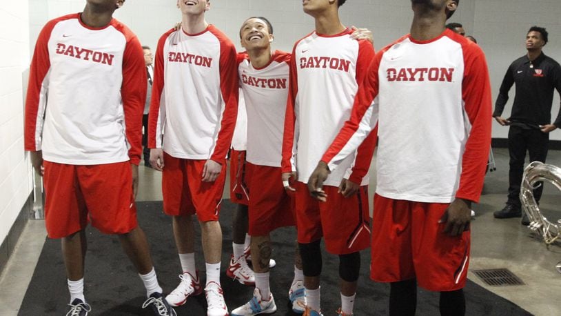 Dayton’s players watch the end of the Oklahoma vs. Albany game as they wait to take the floor before a game against Providence in the second round of the NCAA tournament on Friday, March 20, 2015, at Nationwide Arena in Columbus. David Jablonski/Staff