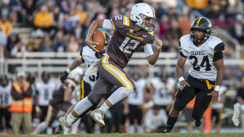 Kenton Ridge High School's Julian Daniels run the ball during their game against Shawnee last season in Springfield. CONTRIBUTED PHOTO BY MICHAEL COOPER