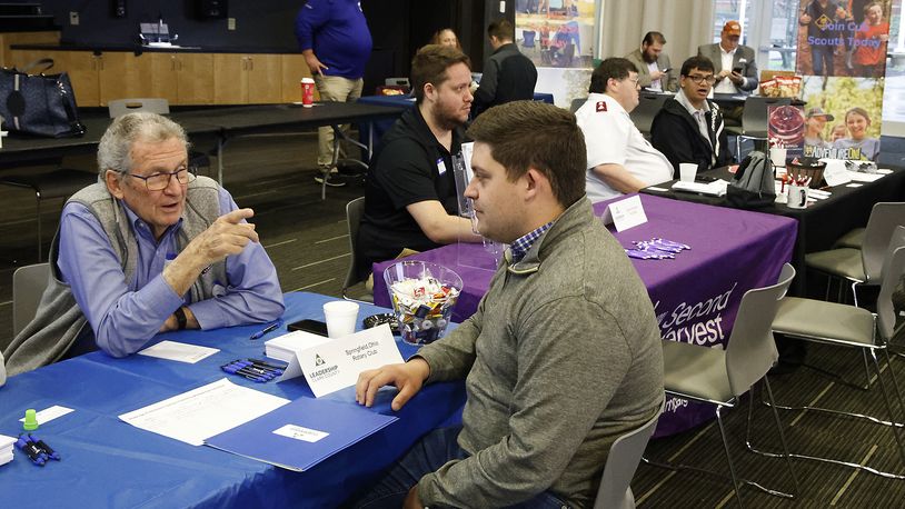 John Detrick, left, talks with James Gray, from Leadership Clark County, about the Springfield Rotary Club Thursday, April 11, 2024 during the Leadership Clark County Non-Profit Fair at the Hollenbeck Bayley Conference Center. BILL LACKEY/STAFF