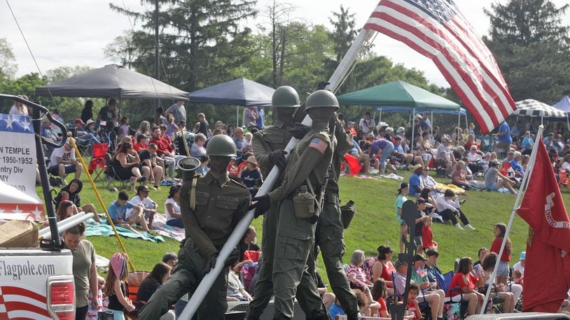 The Springfield Memorial Day Parade will be held at 9 a.m. on Monday, May 27. Last year, thousands of people lined the parade route in their red, white and blue regalia to watch the 2023 Springfield Memorial Day Monday, May 29, 2023. The parade, which featured floats, fire trucks and bands, began with the throwing of the ceremonial wreath into Buck Creek and the somber sound of TAPS playing to honor those who haven given their lives in service to our country. FILE/BILL LACKEY/STAFF