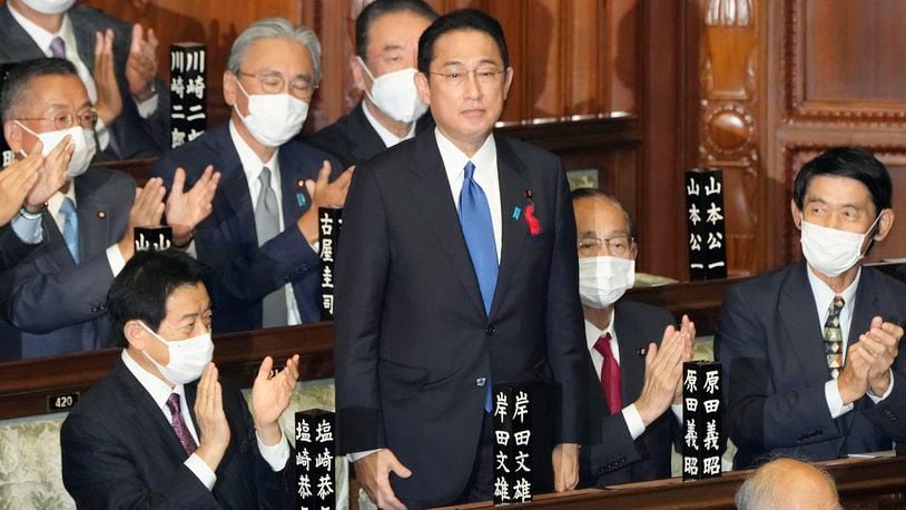 FILE - Fumio Kishida, center, is applauded after being named as Japan's prime minister at the parliament's lower house in Tokyo on Oct. 4, 2021. (Kyodo News via AP, File)