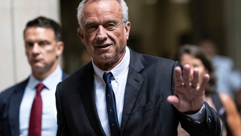 Independent presidential candidate Robert F. Kennedy Jr., waves to the media outside the Nassau County Supreme Court in Mineola, N.Y. on Wednesday, Aug., 21, 2024. (AP Photo/Stefan Jeremiah)