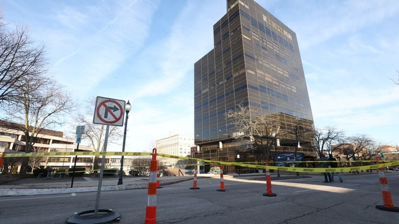 South Limestone Street is blocked between Main and High streets after a glass panel broke on the east side of the EF Hutton Tower on Sunday night./ Bill Lackey