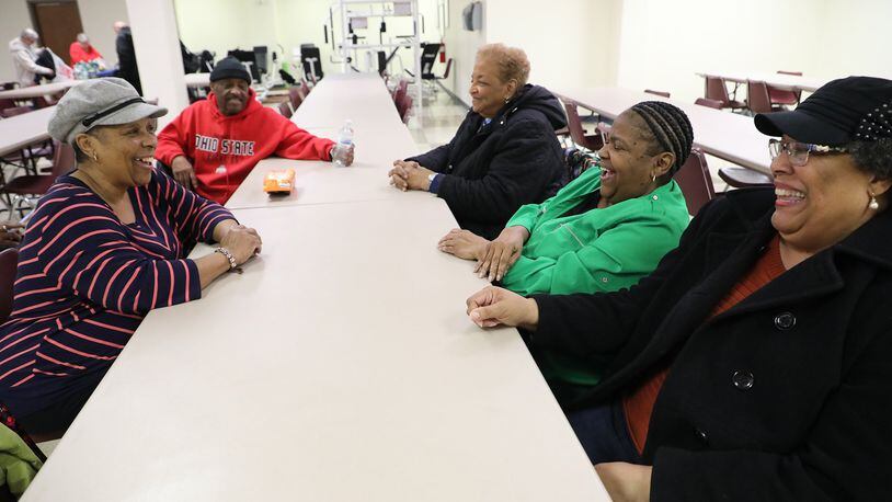 A group of seniors share a laugh as they talk after Bingo on Wednesday, April 4, 2018, at United Senior Services. Bill Lackey/Staff