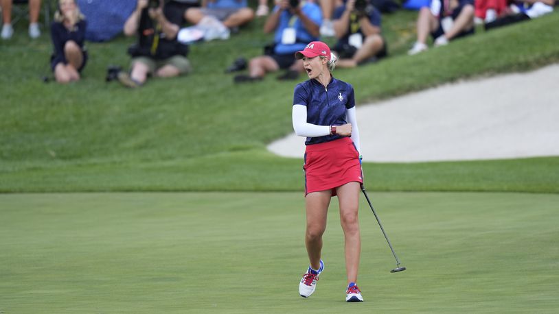 United States' Nelly Korda celebrates after sinking a putt on the 14th hole to win a fourball match during a Solheim Cup golf tournament at Robert Trent Jones Golf Club, Friday, Sept. 13, 2024, in Gainesville, Va. (AP Photo/Chris Szagola)