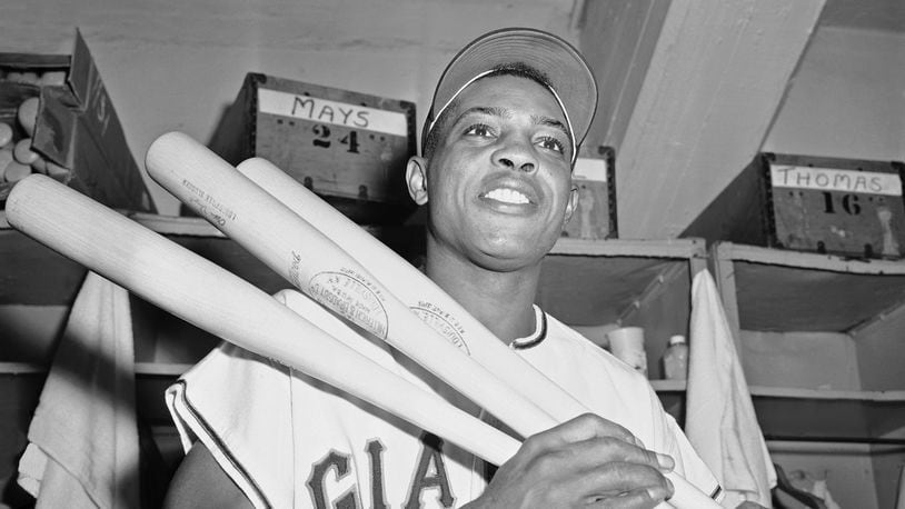 FILE - New York Giants' centerfielder Willie Mays flashes smile in clubhouse at the Polo Grounds in New York after clouting his 20th triple of the season to become first National League player to reach that total since Stan Musial of the St. Louis Cardinals in 1946, Sept. 8, 1957. Willie Mays, the electrifying “Say Hey Kid” whose singular combination of talent, drive and exuberance made him one of baseball’s greatest and most beloved players, has died. He was 93. Mays' family and the San Francisco Giants jointly announced Tuesday night, June 18, 2024, he had died earlier in the afternoon in the Bay Area.(AP Photo/File)