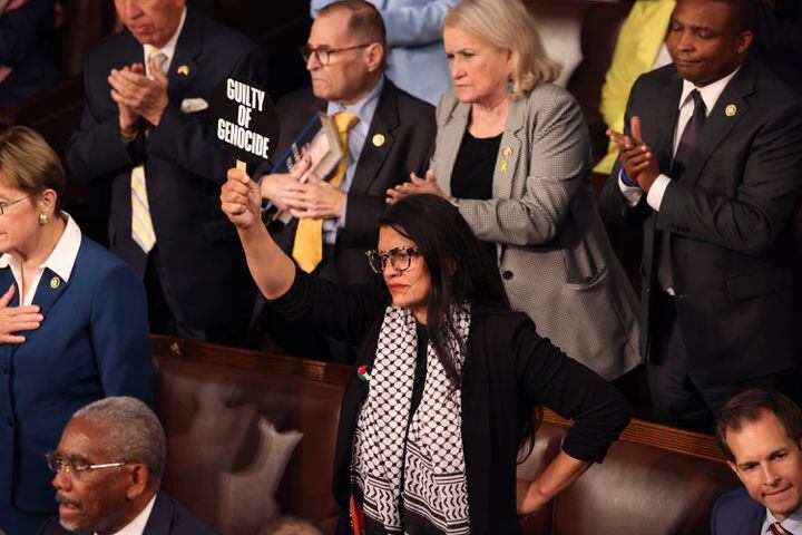 
                        Rep. Rashida Tlaib (D-Mich.) holds up a sign that says “Guilty of Genocide” as Prime Minister Benjamin Netanyahu of Israel speaks to a joint session of Congress at the Capitol in Washington on Wednesday, July 24, 2024. (Maansi Srivastava/The New York Times)
                      