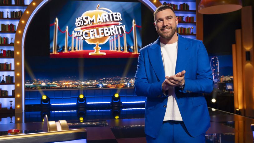 This image released by Prime Video shows NFL football player Travis Kelce, of the Kansas City Chiefs, on the set of the new game show "Are You Smarter Than a Celebrity." (Adam Rose/Prime Video via AP)