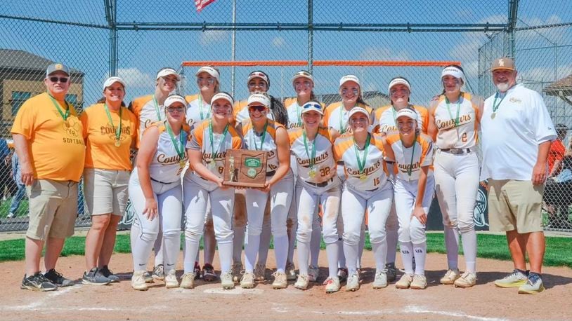 The Kenton Ridge High School softball team poses with a Division II district championship trophy after beating Franklin 13-4 on Saturday afternoon at Arcanum High School. CONTRIBUTED