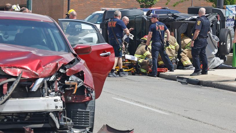 Two people had to be rescued from an overturned Jeep following a two car accident at the intersection of North Street and Fountain Avenue Monday, April 29, 2024. The two people in the Jeep were transported to the hospital with non-life threatening injuries. The driver of the other car was not injured. BILL LACKEY/STAFF