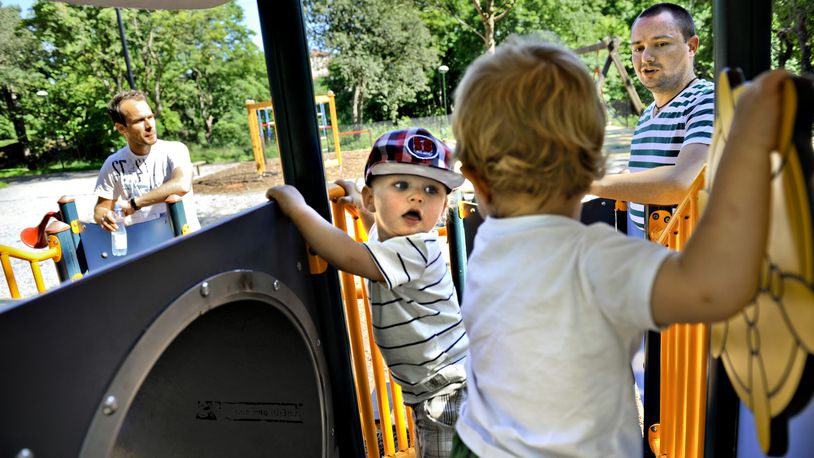 FILE - Henrik Holgersson, right, watches his son, Arvid, center with hat, play with Walter Johansson accompanied by his father Henrik Johansson at a playground in Stockholm, Sweden, Wednesday June 29, 2011. Fifty years after Sweden became the first country in the world to introduce paid parental leave for fathers, the Scandinavian country has launched a groundbreaking new law granting paid leave allowing grandparents and other legal guardians to care for a child. The law came into effect Monday, July 1, 2024, and allows parents to transfer some of their generous parental leave allowance to the child's grandparents or ‘bonus-parent’ — a term often used in Sweden for a step-parent. (AP Photo/Niklas Larsson, File)